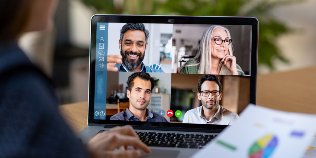 A person sitting at their desk participating in a virtual meeting.