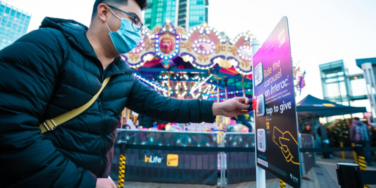 tiptap machine being utilized by a masked individual.