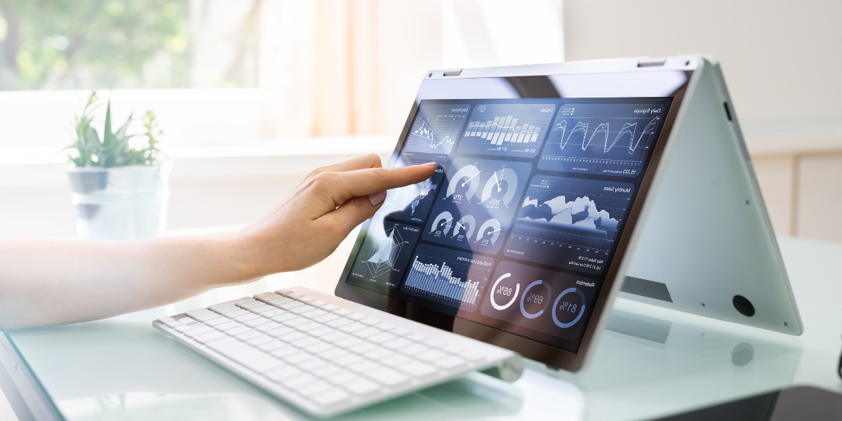 A person sitting at a computer reviewing financial documents.