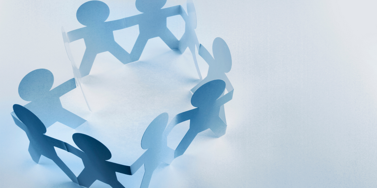 An image featuring cut-out figures of people standing in a circle.