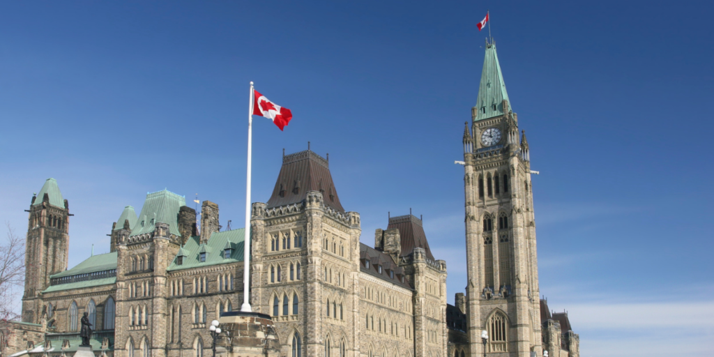 The Parliament of Canada buildings in Ottawa with a bright blue sky in behind.