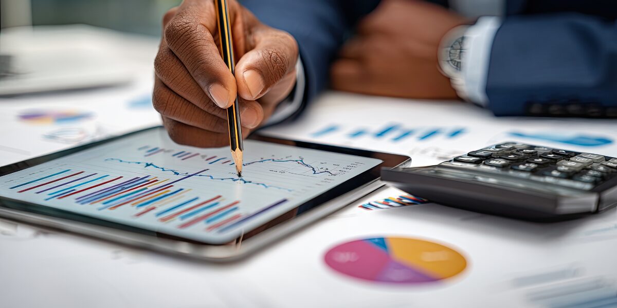 A person is reviewing data on a tablet.